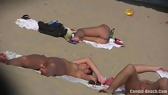 Uninhibited Couples Bask In The Sun And Explore Their Desires On A Candid Beach
